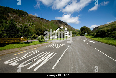 a welsh pub hotel on a slow araf road with Cadar idris mountain range in the distance Stock Photo