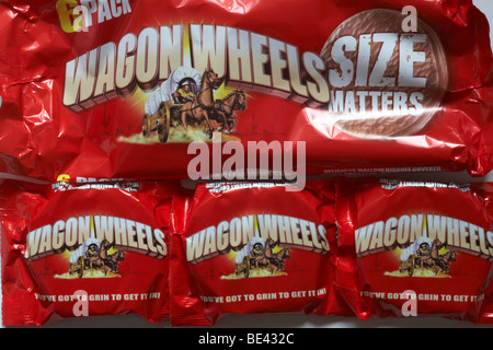 packets of Wagon Wheels biscuits - you've got to grin to get it in - delicious mallow biscuit covered with a chocolate flavoured coating Stock Photo