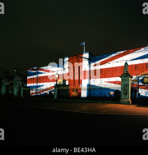 Buckingham Palace with a Union Jack projected onto the front facade at christmas time at night Stock Photo