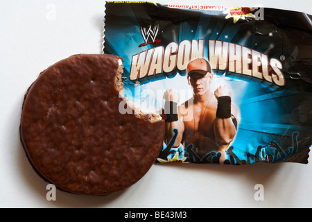 Wagon Wheels biscuit - individual packet of jammie flavour Wagon Wheels biscuits set on white background Stock Photo