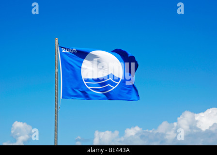 the blue flag awarded for beach and water cleanliness flying over porthmeor beach in cornwall, uk Stock Photo