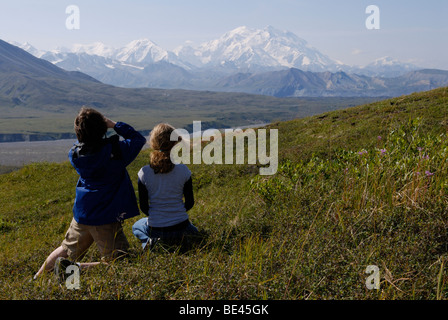 Boy and girl looking at Mt McKinley, Denali National Park, Alaska Stock Photo