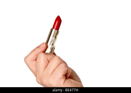 A horizontal image of a womans hand holding red lipstick Stock Photo