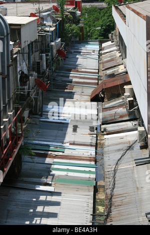 Corrugated metal roof tops on a backstreet , Central Bangkok , Thailand Stock Photo