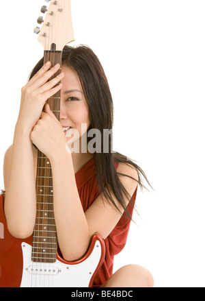 girl with guitar smiling Stock Photo