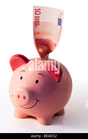 Piggy bank studio shot against a white background with 10 euro note Stock Photo