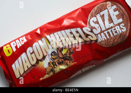 6 pack of original Wagon Wheels biscuits set on white background - delicious mallow biscuit covered with a chocolate flavoured coating Stock Photo