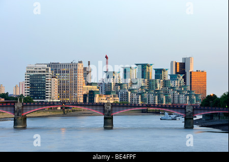 View over the Thames to Lambeth Bridge, in front of modern office buildings in the evening light, London, England, United Kingd Stock Photo