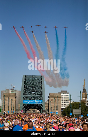 The Royal Air Force's Red Arrows display team fly in formation above the Tyne Bridge during the Great North Run. Stock Photo