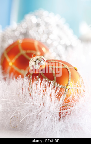Copper-colored Christmas balls, in white snow garland Stock Photo