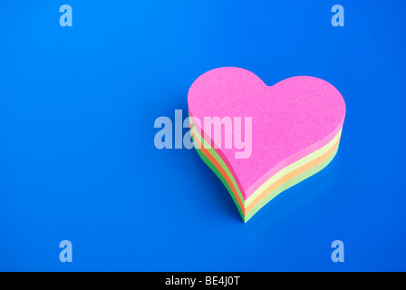 Notepad, heart-shaped, different coloured pieces of paper Stock Photo