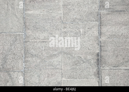 Grunge surface of old concrete wall covered with grey plates Stock Photo