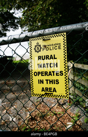 Rural Watch Operates in this Area Sign on farm gate Stock Photo