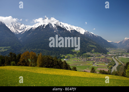 View of the Inntal valley, Pfaffenhofen, Hocheder in the Stubai Alps, dandelion meadow, Oberinntal Upper Inn Valley, Tyrol, Aus Stock Photo
