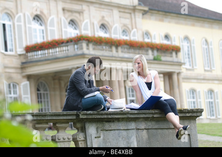 Students at the University of Hohenheim, in front of Hohenheim Castle, Hohenheim, Baden-Wuerttemberg, Germany, Europe Stock Photo