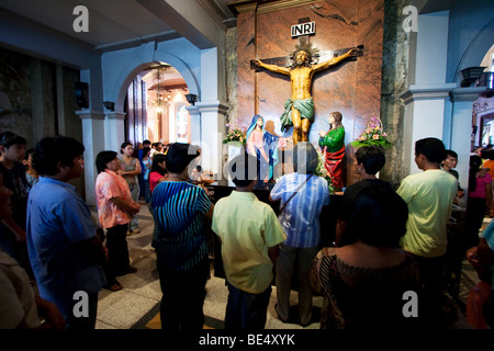 Religious devotees inside the church of Santo Nino in Cebu City Stock ...