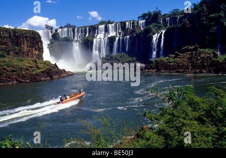 Rubber dinghies getting closer to the falls. Iguazu National Park Falls, Misiones province. Argentina Argentina; Stock Photo