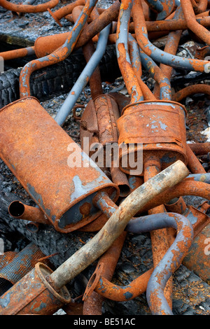 Pile of rusting car exhaust pipes Stock Photo
