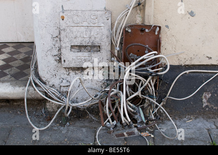 A mass of phone and cable TV leads and other tangled wiring. Stock Photo