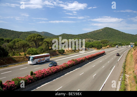 Vehicles travel on the A8 autoroute, La Provencale, in Southern France. Stock Photo
