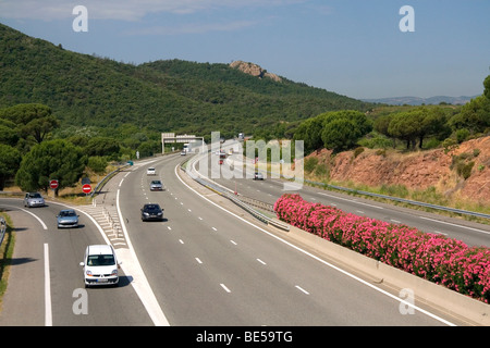 Vehicles travel on the A8 autoroute, La Provencale, in Southern France. Stock Photo