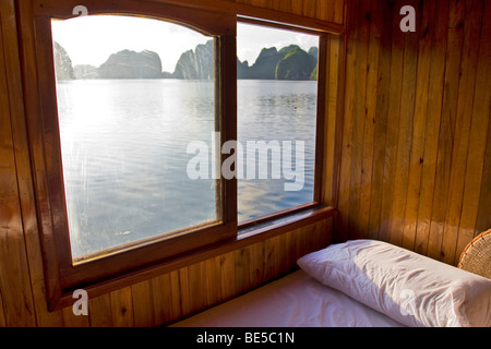 View from the guest cabin during the cruising on a sailing boat in Halong Bay. Vietnam Stock Photo