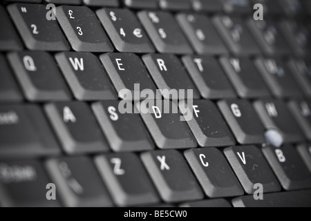 Black and White image of a computer keyboard highlighting the QWERTY keys. Stock Photo