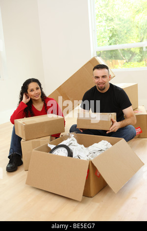 Couple moving in to new home Stock Photo