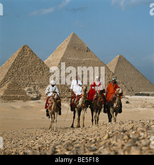 Camel drivers in front of Pyramids, Giza, Cairo, Egypt, North Africa Stock Photo