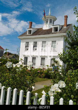 A pretty white house on Commercial Street in Provincetown, Barnstable County Cape Cod Massachusetts USA Stock Photo