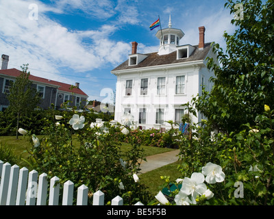 A pretty white house on Commercial Street in Provincetown, Barnstable County Cape Cod Massachusetts USA Stock Photo