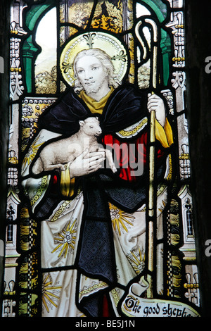 A Stained Glass Window by the Kempe Studios depicting Jesus The Good Shepherd, Hough on the Hill, Lincolnshire Stock Photo