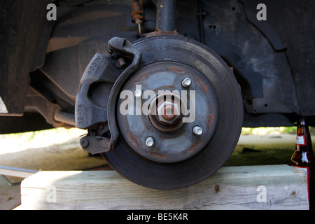 Exposed front disc brake rotor assembly on FWD car, Stock Photo