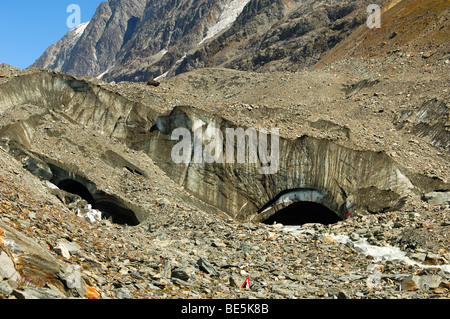 Rocks and debris cover the glacier mouth of the Lang glacier beneath the Loetschenluecke pass, Loetschental, Valais, Switzerland Stock Photo