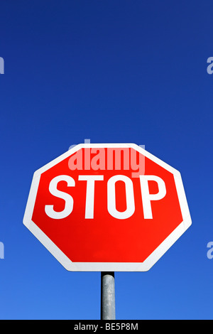 Stop sign against a blue sky Stock Photo