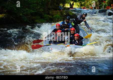 A Group of people white water rafting on the Tryweryn river, National White Water Centre, near Bala Gwynedd north wales UK Stock Photo