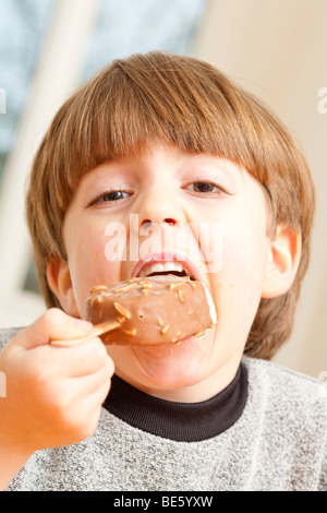 Young boy eating ice cream Stock Photo