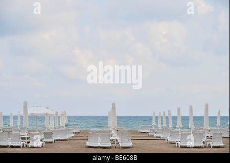 Abandoned deck chairs on the beach in Antalya, Turkey Stock Photo
