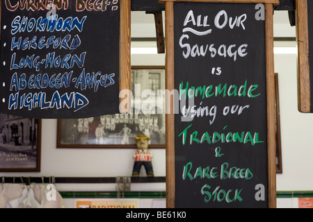 Sign boards on display at Edge and Son, a family-owned butcher at New Ferry, Wirral in north west England, United Kingdom Stock Photo