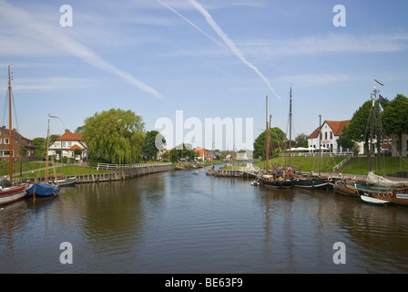 Old Port, Museum Port of Carolinensiel, historic flat-bottomed sailing ships in the port, view over the Harle River towards Har Stock Photo