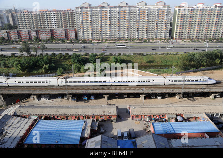 A CRH (China Railway High-speed) bullet train through Beijing city. 21-Sep-2009 Stock Photo