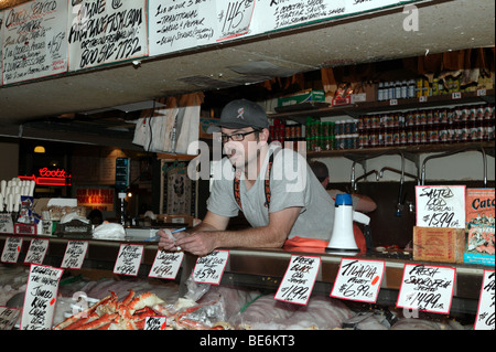 Fishmonger working at the Famous Pike Place Fish Market Stock Photo