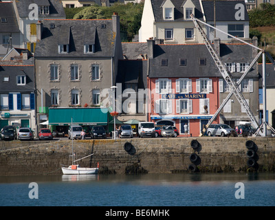 Old quay in the port of Camaret sur Mer with traditional buildings and cafe, Brittany, France Stock Photo
