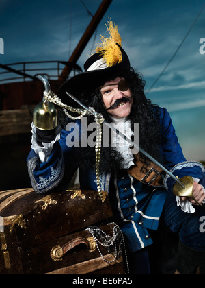 License available at MaximImages.com - Pirate opening a treasure chest Stock Photo