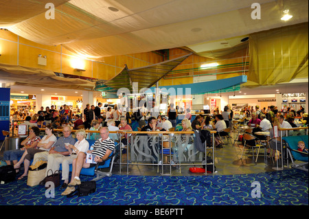 Stores and passengers at an airport gate, waiting area, Brisbane International Airport, Brisbane, Queensland, Australia Stock Photo