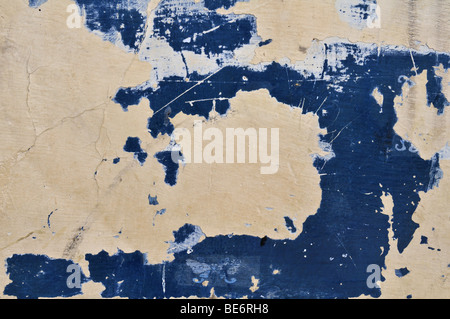 Old and grungy wall with blue and yellow tones Stock Photo