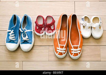 Family's shoes lined up together Stock Photo