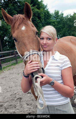 Teenage girl with a horse Stock Photo