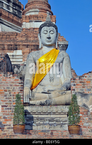 Buddha statue in front of the Great Chedi Chaya Mongkol, Wat Yai Chai Mongkon, Ayutthaya, Thailand, Asia Stock Photo