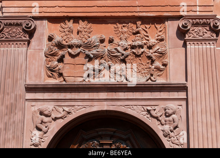 Door with emblem of the House of Isenburg, Isenburg Castle, renaissance facade with arcades, part of the campus of the Universi Stock Photo